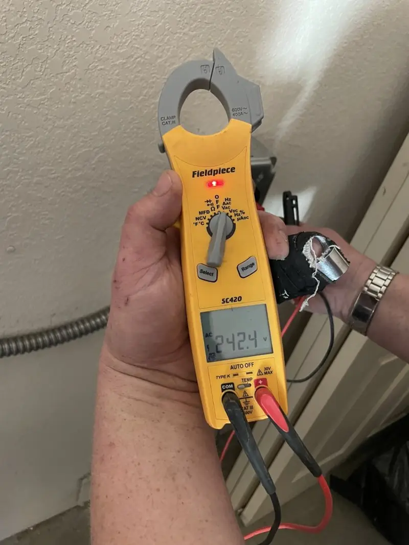 Voltage testing with clamp meter during Electrical Installation Services in Rising Sun-Lebanon